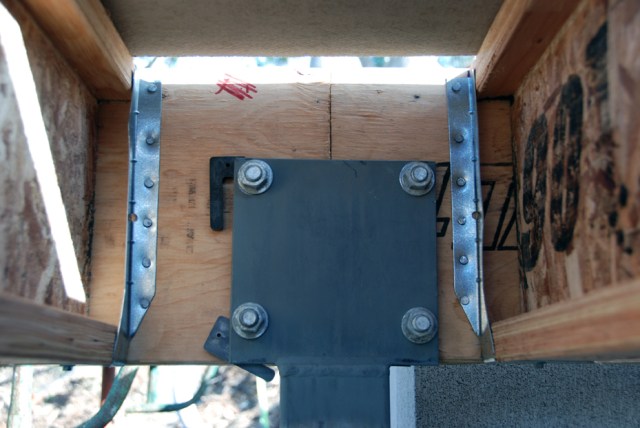 Before they are sealed with the green tongue sub flooring, a last look at the way the LVL I-beam Hyjoists are connected to the LVL perimeter beams using metal joist hangers.